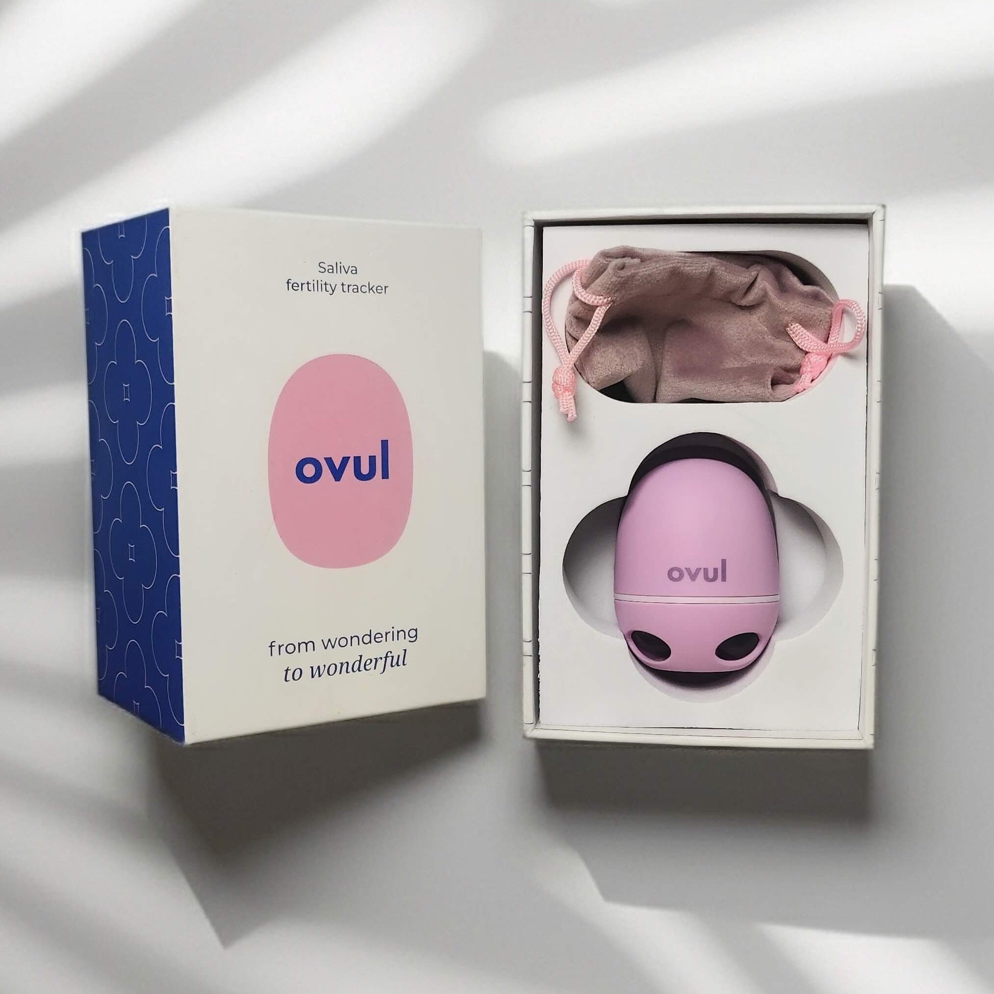 Ovul fertility monitor device with packaging on a light background