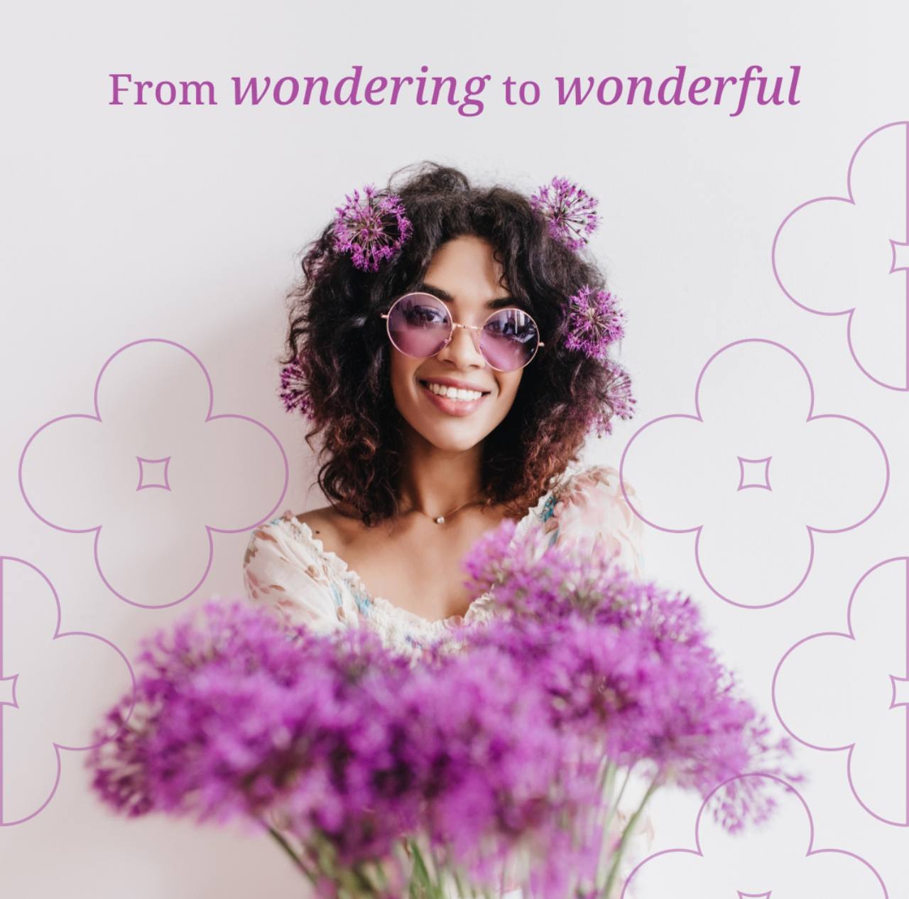 Woman smiling with purple flowers representing Ovul wellness